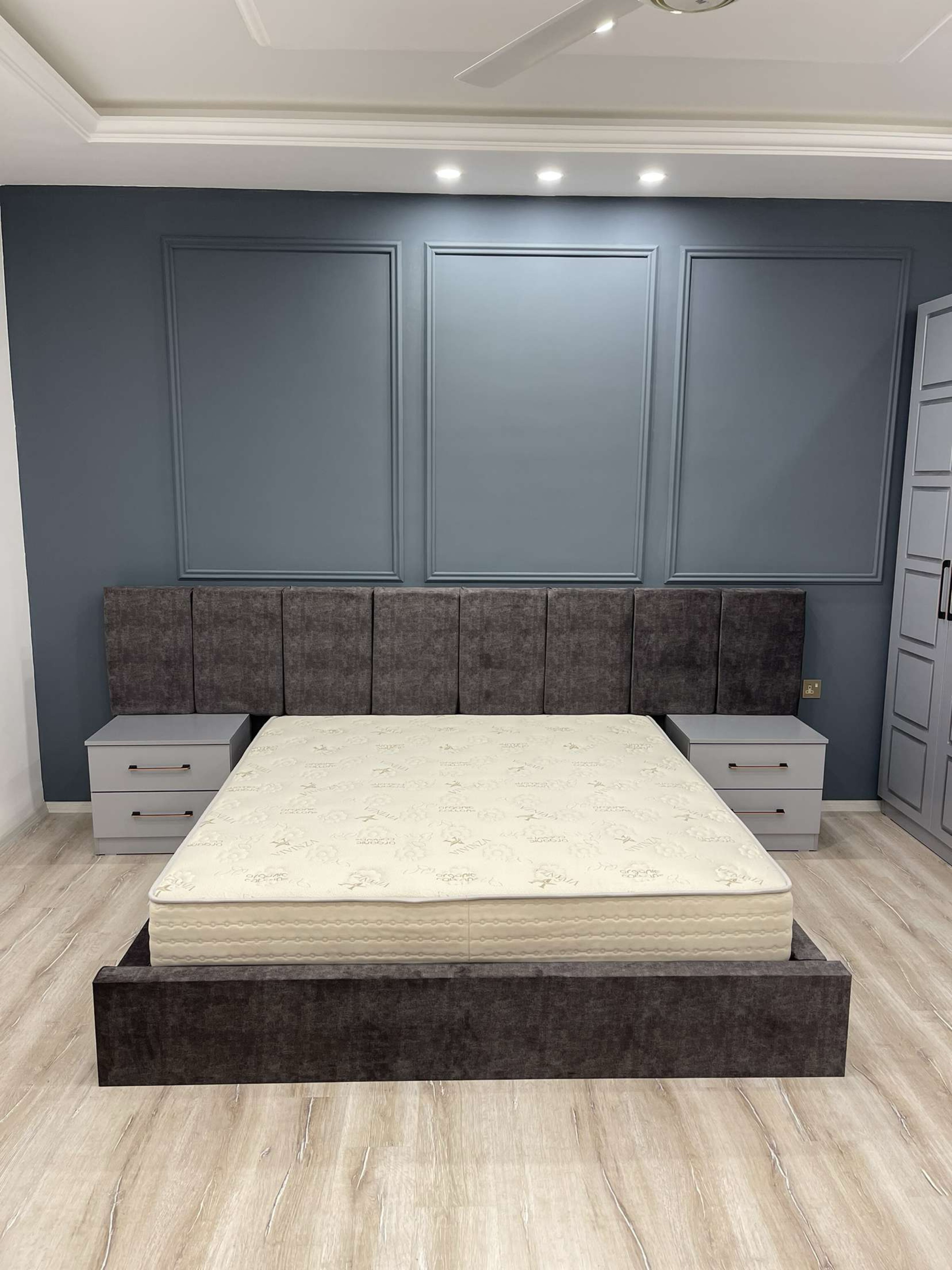 Upholstered panel headboard with floating bed base